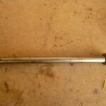 Axe de bras oscillant